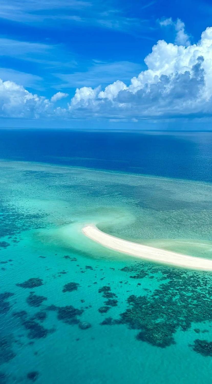 A catamaran at a sandbar on the Great Barrier Reef